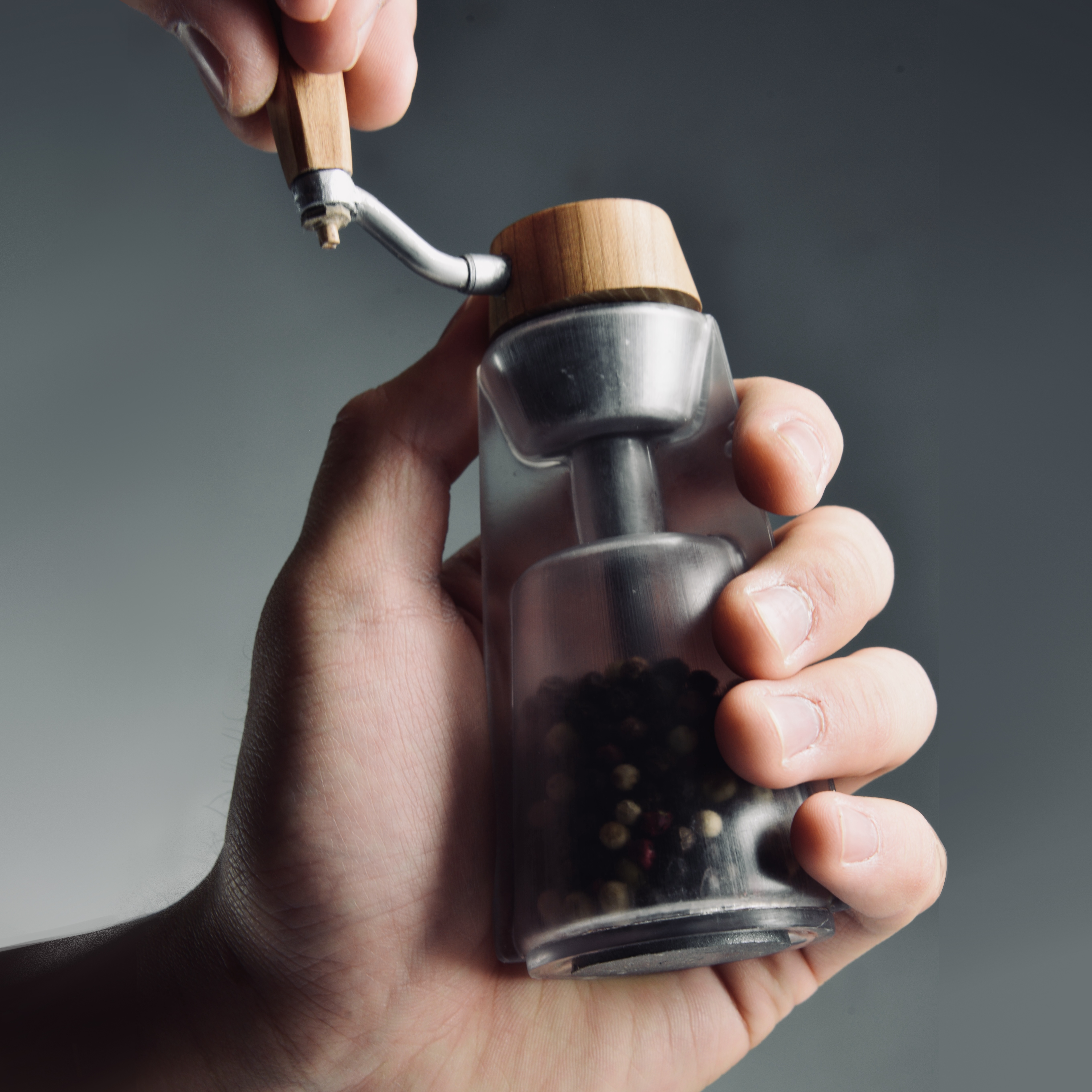 SHI grinder held in the palm